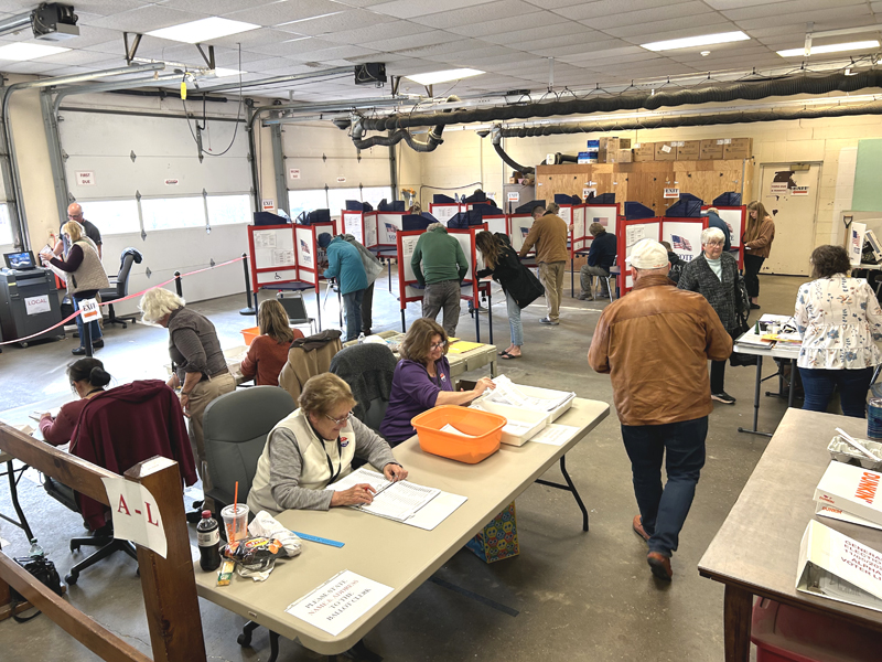 Waldoboro ballot clerks and voters congregate in the garage of the Waldoboro municipal building midday on Tuesday, Nov. 5. (Molly Rains photo)