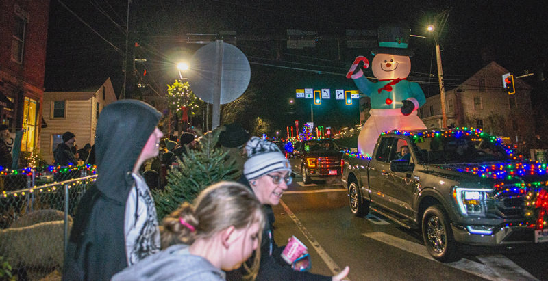 The Merry and Bright Light Parade escorts Santa through Wiscasset village to his workshop during a previous Wiscasset Holiday Marketfest celebration. (Photo courtesy Bob Bond)