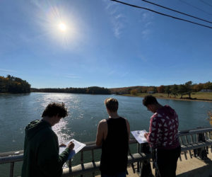 Wiscasset Middle High School American History students studied the Sheepscot River for archeological remains of an early 1600s English settlement in Newcastle and Alna in late October. Shown here (from left) are classmates are Teegan Marr, Spencer Smith-Pinkham and D'Antae Dawkins. (Photo courtesy Wiscasset Middle High School)