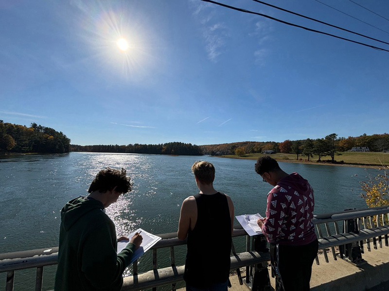 Wiscasset Middle High School American History students studied the Sheepscot River for archeological remains of an early 1600s English settlement in Newcastle and Alna in late October. Shown here (from left) are classmates are Teegan Marr, Spencer Smith-Pinkham and  D'Antae Dawkins. (Photo courtesy Wiscasset Middle High School)