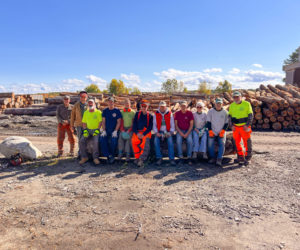 Firewood is an important part of the home heating boost program offered through the Community Housing Improvement Project. Volunteers, known as the Wood Chips, gather after a day of processing wood for neighbors in need. (Photo courtesy Community Housing Improvement Project)