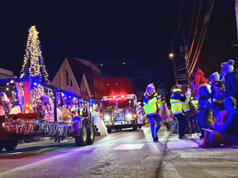 The Parade of Lights makes its way down Main Street in Damariscotta on Saturday, Nov. 30 while participants hand out holiday goodies to the crowd lining the street. (Johnathan Riley photo)