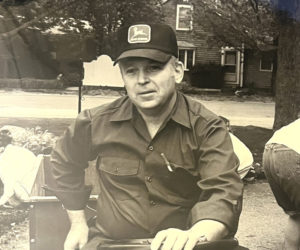 Daniel "Dan" Pinkham rides a tractor in June 1997. Pinkham, a longtime teacher and coach at Lincoln Academy, died on Friday, Dec. 6 at Gosnell House in Scarborough. (LCN file)