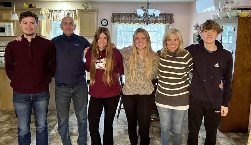 Longtime local educator Scott White stands with his wife Carrie and children Patrick, Madelyn, Grace, and Gavin. White was diagnosed with brain cancer this fall, prompting a strong community response of support and outreach from former students, athletes, and others who know him as an educator, coach, mentor, and friend. From left: Patrick, Scott, Madelyn, Grace, Carrie, and Gavin White. (Courtesy photo)