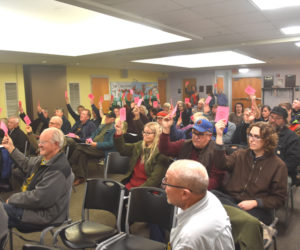 Wiscasset residents vote to allocate $353,750 from fund balance as a grant match toward phase one of the town's wastewater treatment plant relocation project during a special town meeting on Tuesday, Dec. 3. (Molly Rains photo)