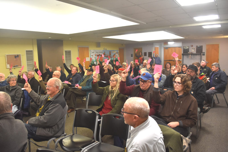 Wiscasset residents vote to allocate $353,750 from fund balance as a grant match toward phase one of the town's wastewater treatment plant relocation project during a special town meeting on Tuesday, Dec. 3. (Molly Rains photo)