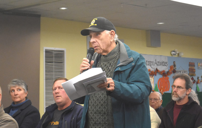 Wiscasset resident Ed Polewarczyk speaks during a special town meeting on Tuesday, Dec. 3, during which residents voted to authorize the allocation of $353,750 from fund balance toward the first phase of a wastewater treatment plant relocation project. Polewarczyk said he was concerned that funds may be difficult to acquire for future phases of the project, which Town Manager Dennis Simmons said may take upward of five years. (Molly Rains photo)