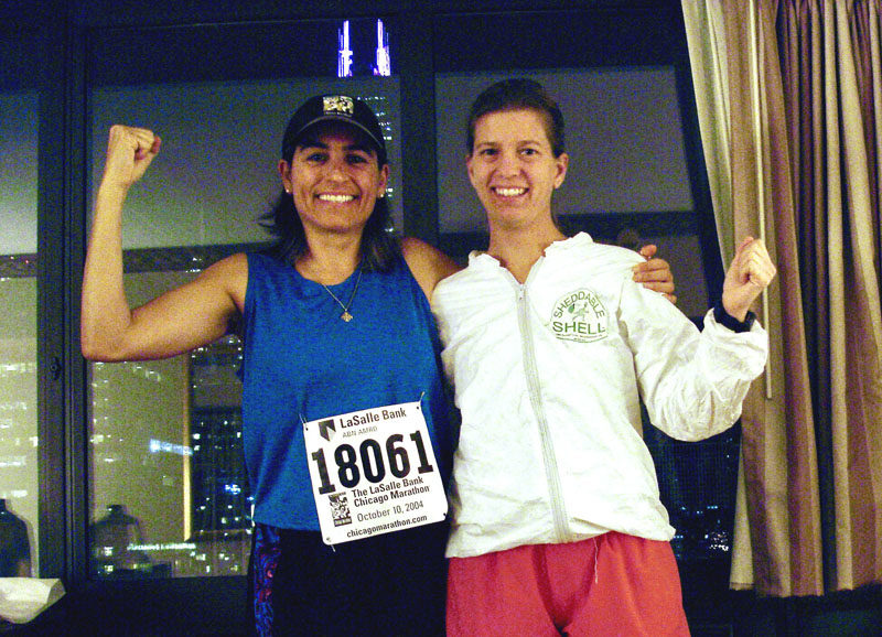 Andrea Di Benedetto and Deb Taylor celebrate after running their first marathon together in Chicago in 2004. (Courtesy photo)