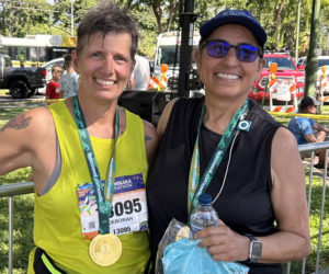 Deb Taylor and Andrea Di Benedetto are all smiles after finishing the Honolulu Marathon on Dec. 8. The marathon completed the best friends quest to run a marathon in all 50 states. (Courtesy photo)