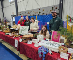 Members of the South Bristol School class of 2025 work with Matt Kellet, their advisor, during the craft fair. (Courtesy photo)