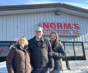 Norman Norm Sherman, founder and president of Norm's Used Cars, is flanked by his wife and company Vice President Beverly Needham (left) and daughter and dealership Office Manager Katie Johnson. Sherman, who was raised in Wiscasset, founded Norm's Used Cars alongside his mother and father in 1977 and has continued to operate the dealership as a family business ever since. (Molly Rains photo)