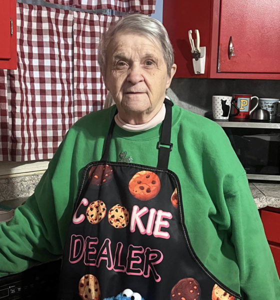 Nancy Dedrick wears her favorite apron in the kitchen of her Newcastle home on Dec. 26. Dedrick, who was born and raised in Newcastle, has spent the last 40 years making baked goods for local businesses and friends. "I love making people happy," she said. "It's what you give in life, not what you get back." (Piper Pavelich photo)