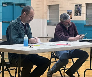 AOS 93 Board members Wayne Parlin (left) and Matthew Benner review a revised central office budget during a meeting Tuesday, Jan. 14. The proposed $1,094,247.32 budget will be considered by residents of Bristol, Jefferson, Nobleboro, and South Bristol on Wednesday, Jan. 22. (Piper Pavelich photo)