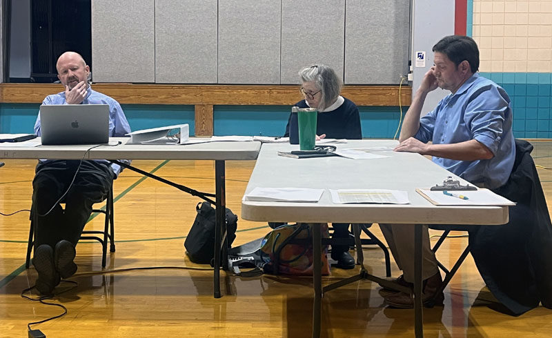 AOS 93 Superintendent Todd Sanders (left) explains revisions made to the central office budget to AOS 93 Board members June Donenfeld and Christian Cotz during a meeting Tuesday, Jan. 14. Revisions to the budget that was rejected by voters include the removal of the assistant special education director position, as well as cuts to the business office clerk salaries and benefits and superintendent health insurance lines. (Piper Pavelich photo)