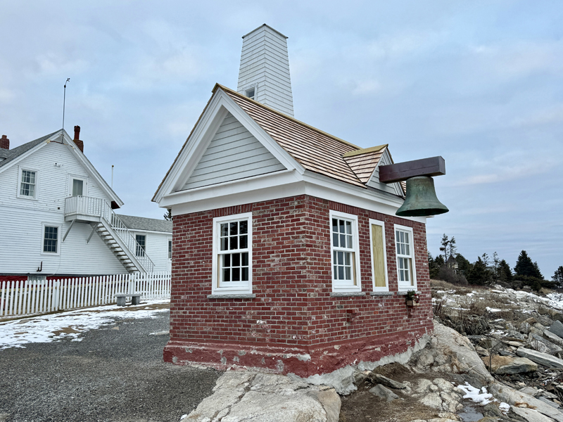 The bell house in Pemaquid Point Lighthouse Park on Monday, Jan. 13, a year after historic storms knocked in the eastern facing wall, uprooted the white fence around the museums, and damaged the siding of the building. A ceremony for the completion of the bell house was held in September 2024. (Johnathan Riley photo)