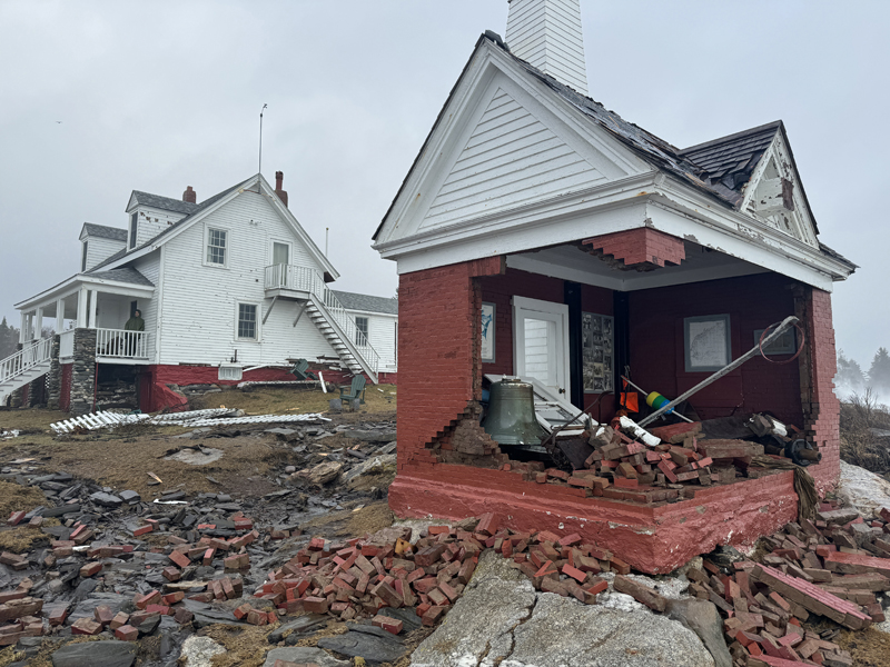 The bell house in Pemaquid Point Lighthouse Park in Bristol after it took significant damage in the Jan. 10, 2024 storm. In preparation for the Jan. 13, 2024 storm, park officials cleaned the debris, moved the bell to the back corner of the structure, and put up wooden beams for additional support. The white picket fence surrounding the fishermans museum was knocked down as well. (Johnathan Riley photo)