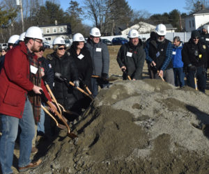 Using ceremonial hard hats and shovels, Waldoboro town officials and first responders break ground at 130 Depot St., where a MaineHealth medical office building, and a possible future Waldoboro community center, are both planned. Construction on the medical office building will begin this winter following the Monday, Jan. 6 groundbreaking. (Molly Rains photo)