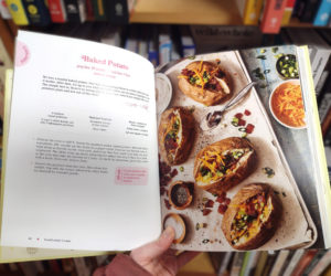 Browsing a copy of Good Lookin Cookin at Shermans Maine Coast Book Shop. (Photo courtesy Healthy Lincoln County)