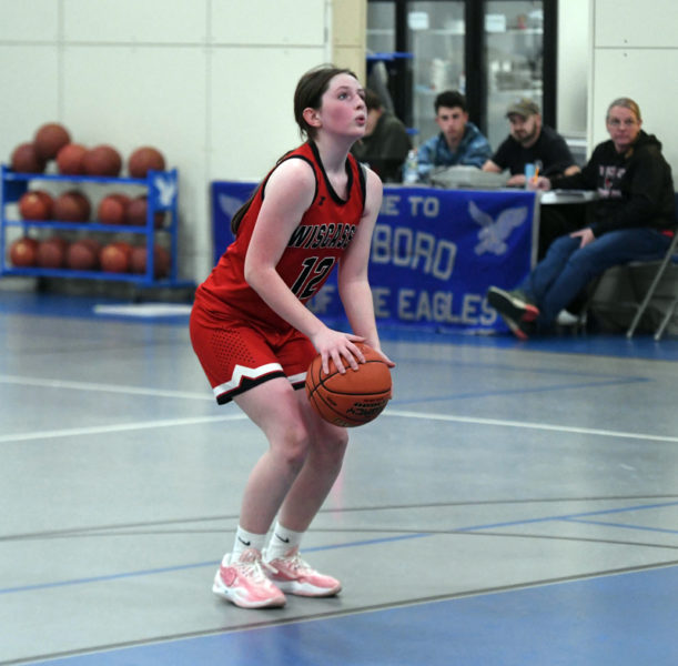 Xoe Morse prepares to shoot one of her two free throws with less than a minute remaining during the Wolverines' emotional 24-21 win over Islesboro on Friday, Jan 10 in Islesboro. Morse, a sophomore, scored all five of her points during the fourth quarter to help the girls break a 122-game losing streak that dated back to 2016. (Mic LeBel photo)