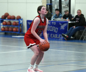 Xoe Morse prepares to shoot one of her two free throws with less than a minute remaining during the Wolverines' emotional 24-21 win over Islesboro on Friday, Jan 10 in Islesboro. Morse, a sophomore, scored all five of her points during the fourth quarter to help the girls break a 122-game losing streak that dated back to 2016. (Mic LeBel photo)