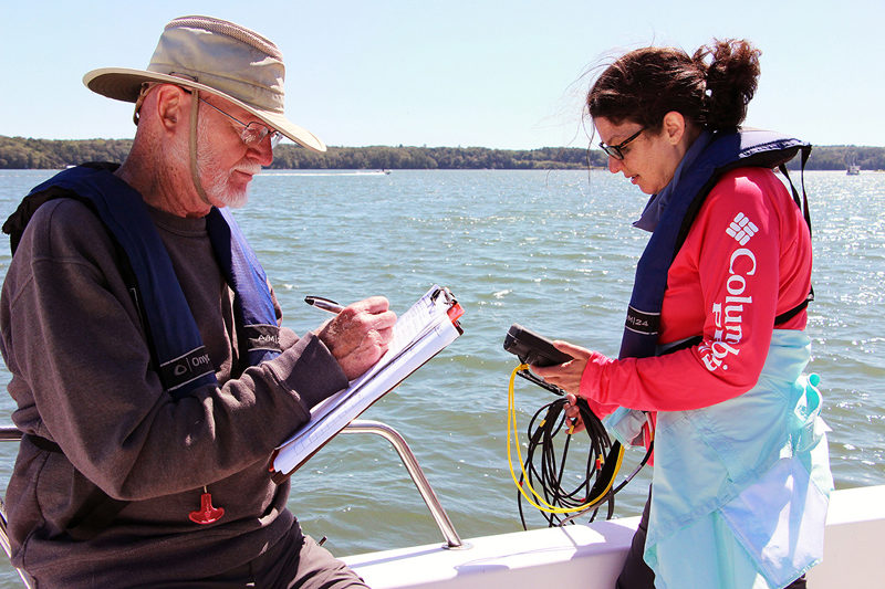 Volunteers with Coastal Rivers estuary water quality monitoring program take water samples and measurements to help researchers understand changing conditions. (Photo courtesy Kris Christine)