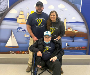 Ian Michaud (center), with his parents Ira Michaud and Kristin Michaud (Photo courtesy Jenn Caron)