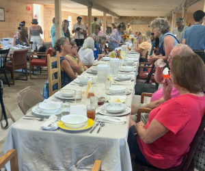 Inn Along the Way's long barn fills for the Community Plate story-sharing potluck. (Courtesy photo)
