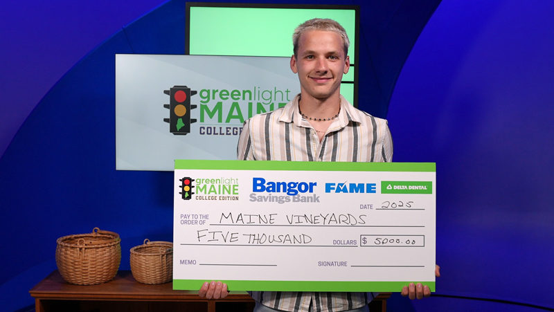 Zephyr Lani-Caputo with his third place winnings of $5,000. (Photo courtesy Thomas College)