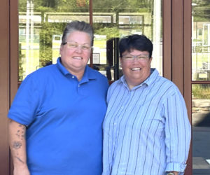 Jody (left) and Liz Matta pose outside of their home, Kiah Bailey Hall, on the Lincoln Academy campus in Newcastle. The couple moved to Newcastle in 2015 to become dorm parents after their youngest child graduated Morse High School. (Sherwood Olin photo)