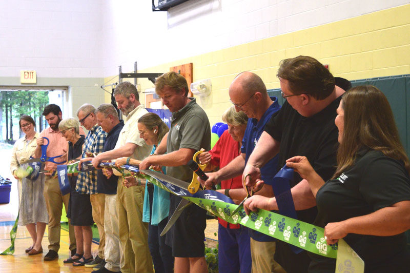 Representatives from Fidium Fiber and town officials celebration the completion of a fiber network during a ceremony at the Wiscasset Community Center on Thursday, Aug. 14. Fidium Fiber recently completed connectivity projects in 10 Lincoln County towns and neighboring Woolwich. (Ali Juell photo)