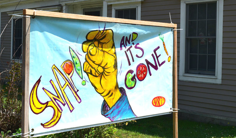 A sign on Main Street in Newcastle depicts concern around reduced SNAP funding on Monday, July 28. According to Feeding America data, 13.8% of the Maine population was food insecure in 2023. (Ali Juell photo)