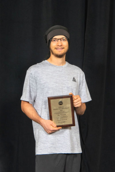 Alex Tomasello, of Damariscotta, receives the Atlantic Area Hero Award from the National Rural Letter Carriers' Association on Wednesday, Aug. 20 in Orlando, Florida. Tomasello was honored for rescuing someone from a Newcastle waterway while on his route in March. (Photo courtesy National Rural Letter Carriers' Association)