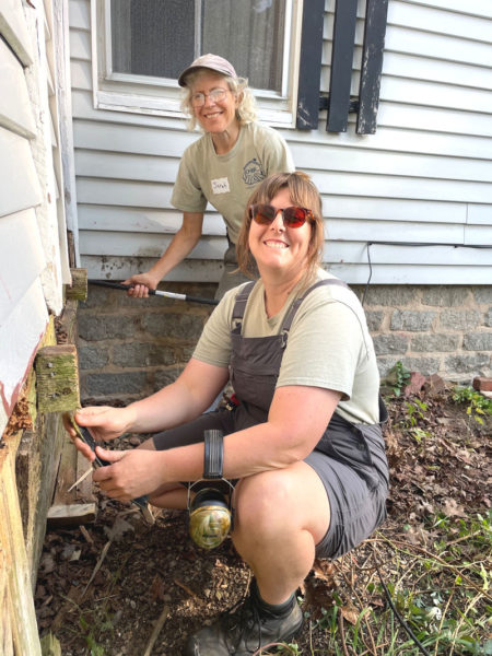 Sarah Highland (back) and Bailey Romaine work side-by-side during Community Cares Day in 2024. This year's volunteering event will be held Saturday, Sept. 13. (Photo courtesy Angela Kortemeier)