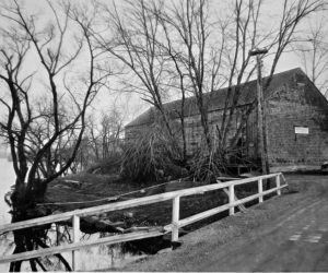 The former ice house at Damariscotta Mills overlooks Damariscotta Lake. The sign on the front of the house says, "Jones Coal & Ice Co., G.H. Melville." This was the previous location of the Gorham House. The land now belongs to the town of Nobleboro and is known as "the ice house lot." (Photo courtesy Nobleboro Historical Society)