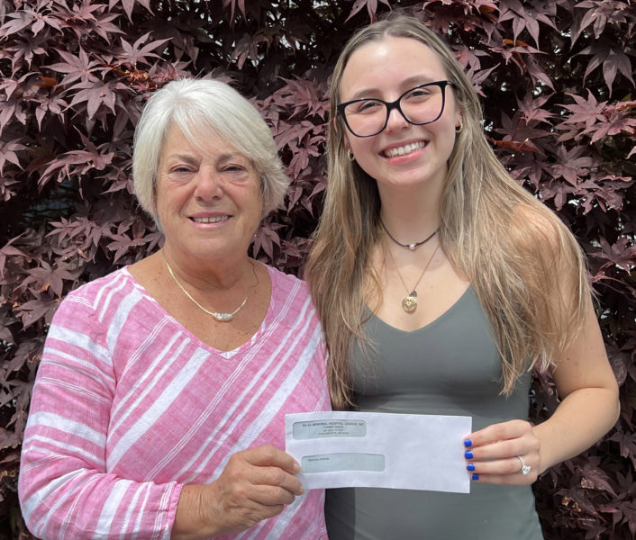 The inaugural Shirley Gallagher Memorial Nursing Scholarship recipient Madison Holmes (left) accepts her award from Miles Memorial Hospital League Board Chair Ann McFarland. (Photo courtesy Trudy Reilly)