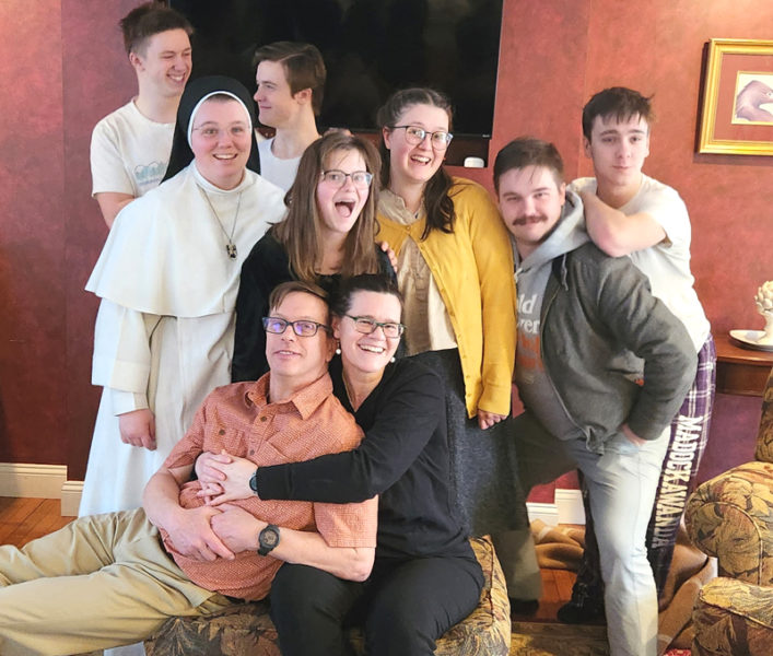 In an increasingly rare sight, all nine members of the Eddyblouin family convene while in Connecticut in February for the funeral of the children's grandfather, Charlie Blouin. Front row, from left: John and Allison Eddyblouin. Middle row, from left: Sister John Henry, Agnes, Thalia Parr, John Henry, and Blaise Eddyblouin. Back row, from left: Arveragus and Thadeus Eddyblouin. (Courtesy photo)