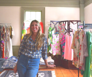Annie Pathik stands beside the new and previously loved clothes at Turn Style, at 170 Main St. in Damariscotta, on Friday, Aug. 29. Pathik said she wants the store to provide affordable and beautiful style options. (Ali Juell photo)