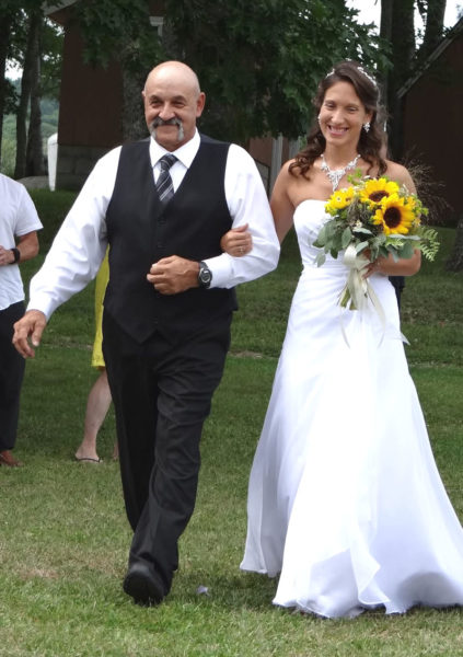 Breanna Lawrence is escorted down the aisle by her father Arthur Waltz on the day of her wedding to Evan Lawrence on Aug. 11, 2018. Although she has legally adopted her husbands last name, Breanna Lawrence but said she is still largely known as Breanna Waltz. (Courtesy photo)