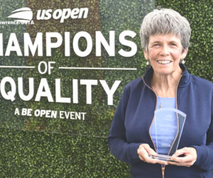Lisa Gilbride holds the New England Champion of Equality Award she was presented during the U.S. Open tennis tournament on Sept. 4 in Flushing, N.Y. Gilbride served as the CLC YMCA paddle sports director in Damariscotta for 27 years before retiring in 2022. (Photo courtesy Mike Lawrence)