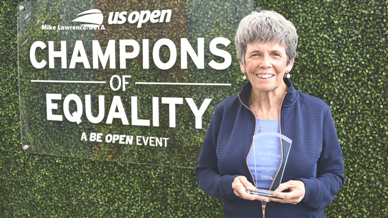 Lisa Gilbride holds the New England Champion of Equality Award she was presented during the U.S. Open tennis tournament on Sept. 4 in Flushing, N.Y. Gilbride served as the CLC YMCA paddle sports director in Damariscotta for 27 years before retiring in 2022. (Photo courtesy Mike Lawrence)