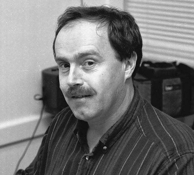 Kevin Burnham at work in the offices of the Boothbay Register circa 1990. Burnham was hired a staff reporter in 1987 and was named the newspaper's editor in January 1988. (Photo courtesy Boothbay Register)