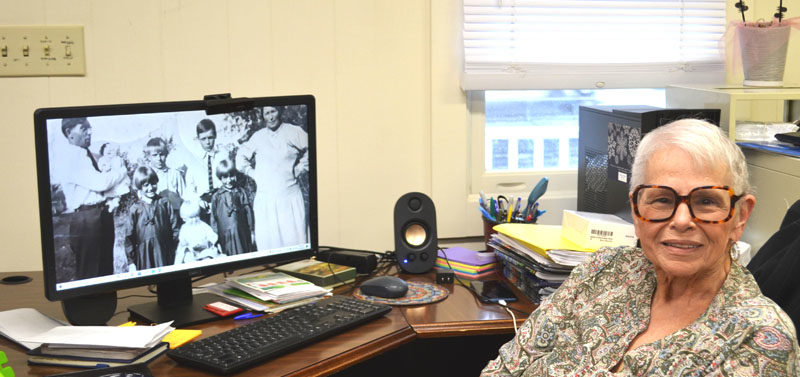 Wiscasset Area Chamber of Commerce Executive Manager Patricia Cloutier sits at her desk at the Lincoln County Regional Planning Commission office last week. After 10 years of greeting visitors and employees as they enter the building, Cloutier retired from the position Wednesday, Oct. 1. (Charlotte Boynton photo)