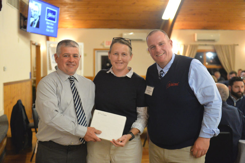 Fritz and Naomi Miller receive their Legends Awards from Midcoast Sports Hall of Fame Board member Jacob Newcomb. (Paula Roberts photo)