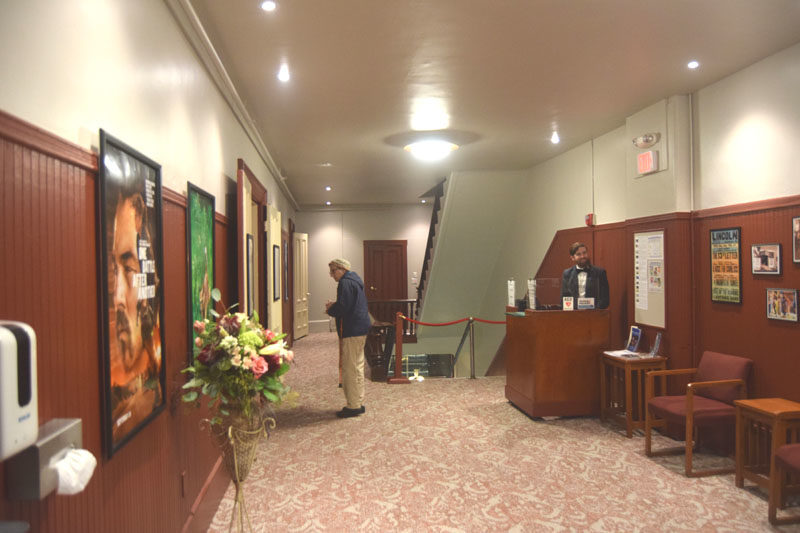 The newly renovated Lincoln Theater lobby is ready for attendees of the reopening gala on Saturday, Nov. 1. The former blue color scheme has been replaced with shades of red, gold, and gray to better match the auditorium, according to the current Executive Director Christina Belknap. (Christina Wallace photo)