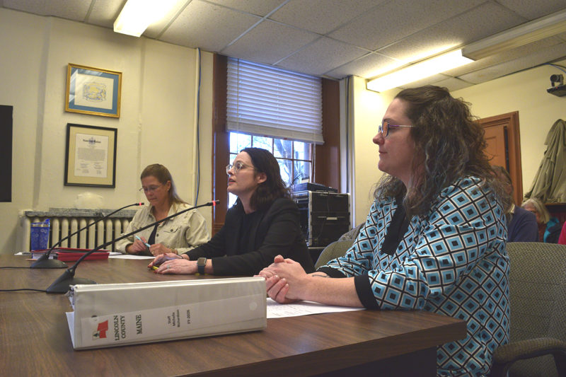 County Administrator Carrie Kipfer (left), District Attorney Natasha Irving (center), and Finance Director Michelle Richardson sit before the county commissioners during their Tuesday, Oct. 4 meeting. Following a $1 recommendation for the district attorney's office by the Lincoln County Budget Advisory Committee, Irving said straying from her office's $519,777 request would hurt her staff members. (Ali Juell photo)