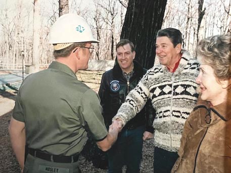 With Camp David Commander Capt. James Broaddus and First Lady Nancy Reagan looking on, Chief Petty Officer Paul Mosely (left) receives a handshake and a smile from President Ronald Reagan during a tour of the extensive recreational facility Mosely and his detachment built for the first family and Camp David staff in 1986. (Photo courtesy Paul Mosely)