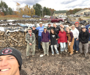 Kieve Wavus Education staff joins the Wood Chips, a group of volunteers for Community Housing Improvement Projects wood bank, for a day of processing during which they processed six cords of wood and stacked five. Firewood will be distributed to needy households. (Photo courtesy Community Housing Improvement Project)