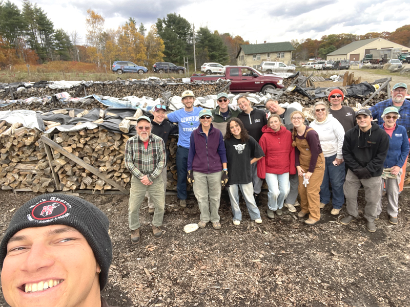 Kieve Wavus Education staff joins the Wood Chips, a group of volunteers for Community Housing Improvement Projects wood bank, for a day of processing during which they processed six cords of wood and stacked five. Firewood will be distributed to needy households. (Photo courtesy Community Housing Improvement Project)