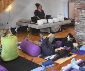 Participants stretch and snuggle kittens during kitten yoga at Live From Love Center in Bremen on Sunday, Nov. 30. The event was a collaboration between the studio and Midcoast Humane. (Claire Taylor photo)