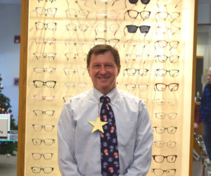 Dr. John McCormick, of Coastal Family Eye Care, stands in the Damariscotta practice on his last day of work before retirement on Tuesday, Dec. 16. McCormick, who worked at the practice for 35 years, said one of the biggest highlights of his career was being able to give back to the community. (Christina Wallace photo)